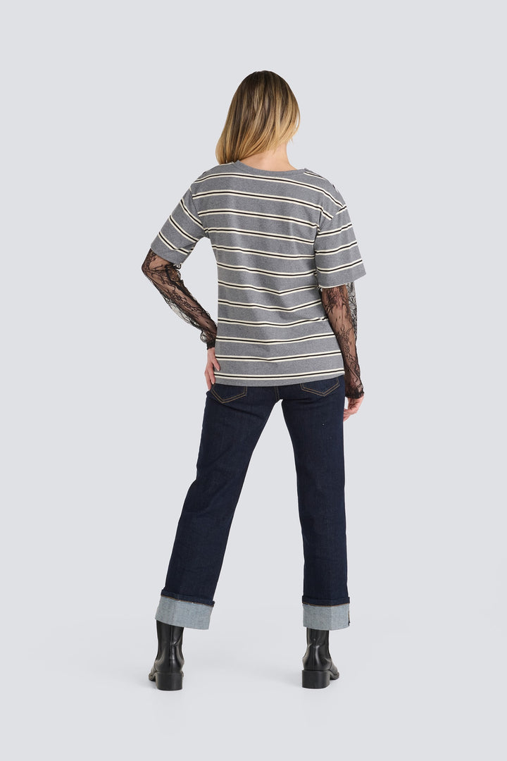 Grey horizontal-striped t-shirt with sheer black lace sleeves.
