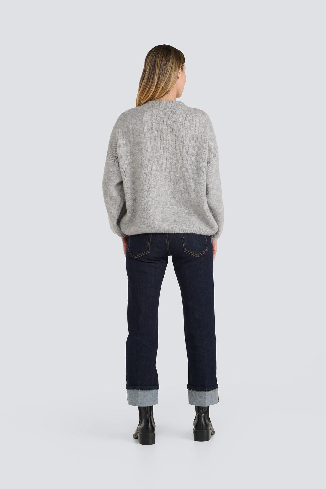 Light gray oversized knit sweater with ribbed trim, shown from the back.