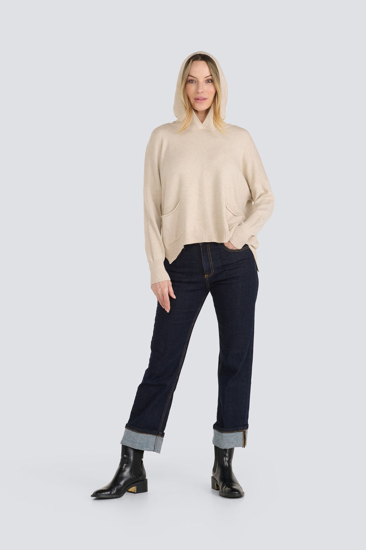 Beige knit hooded sweater with long sleeves and front pockets.