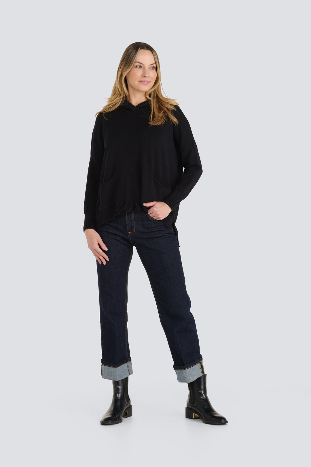 Black long-sleeve knit hoodie with front pockets and ribbed trim.