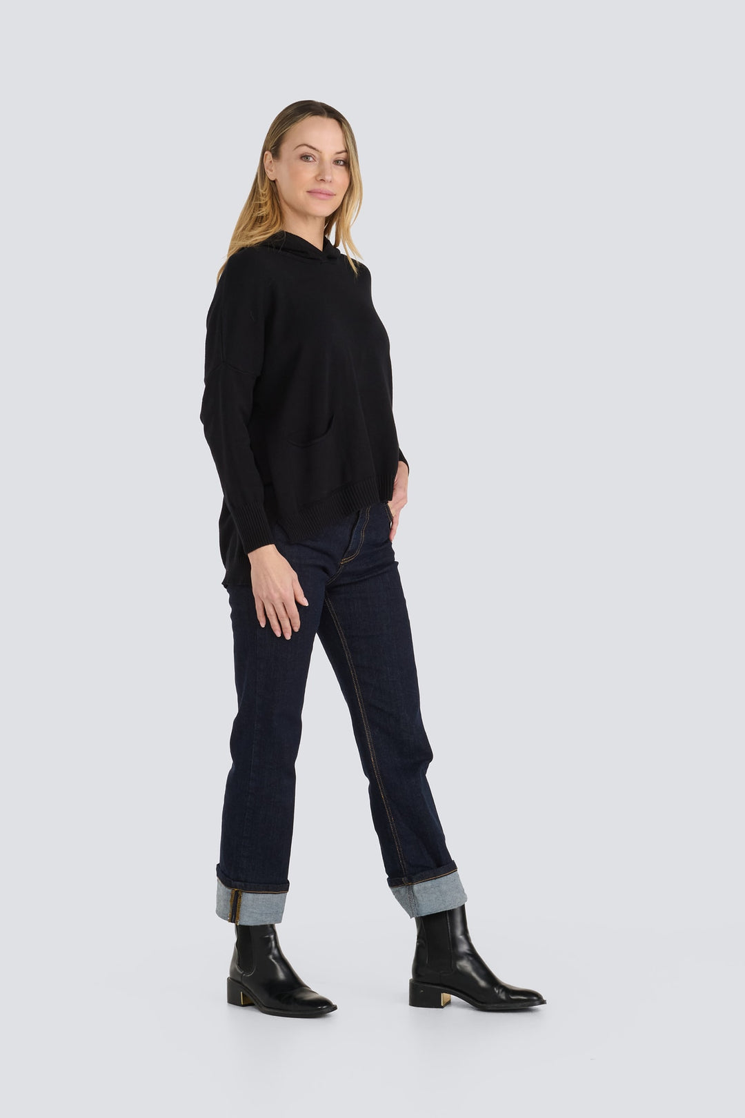 Black knit hooded sweater with long sleeves, front pockets, and a ribbed hem.