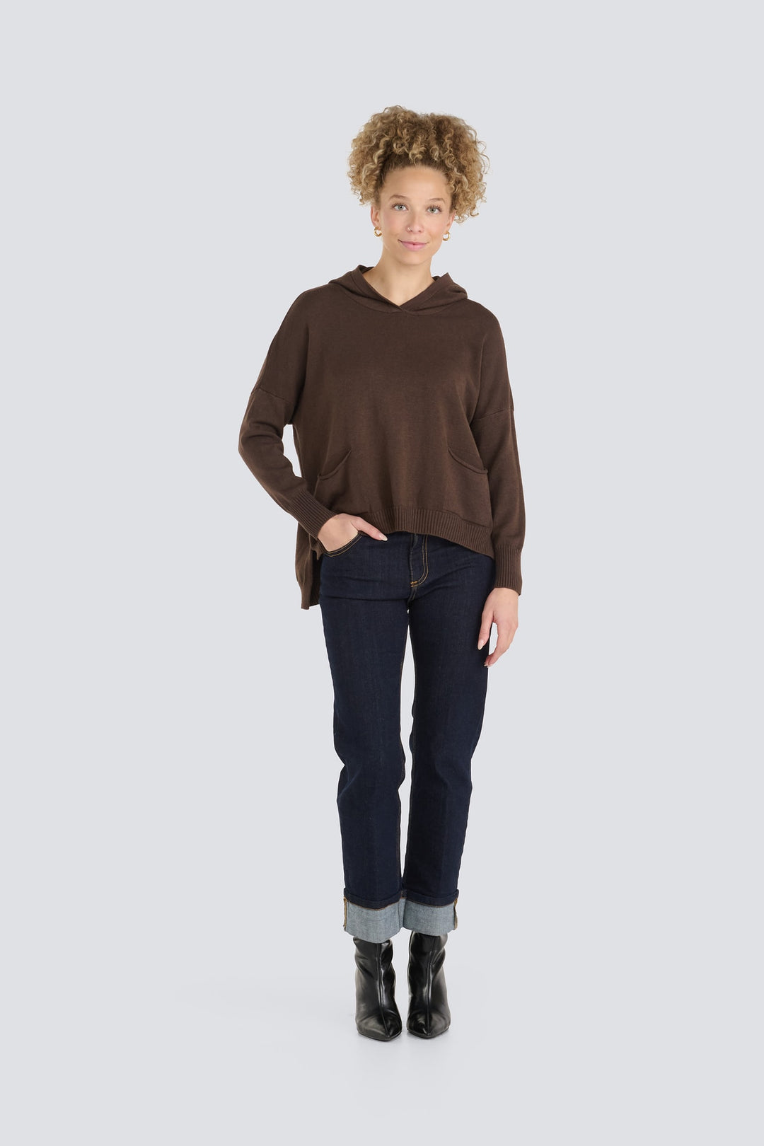 Dark brown knit hoodie sweater with front pockets and a relaxed fit.