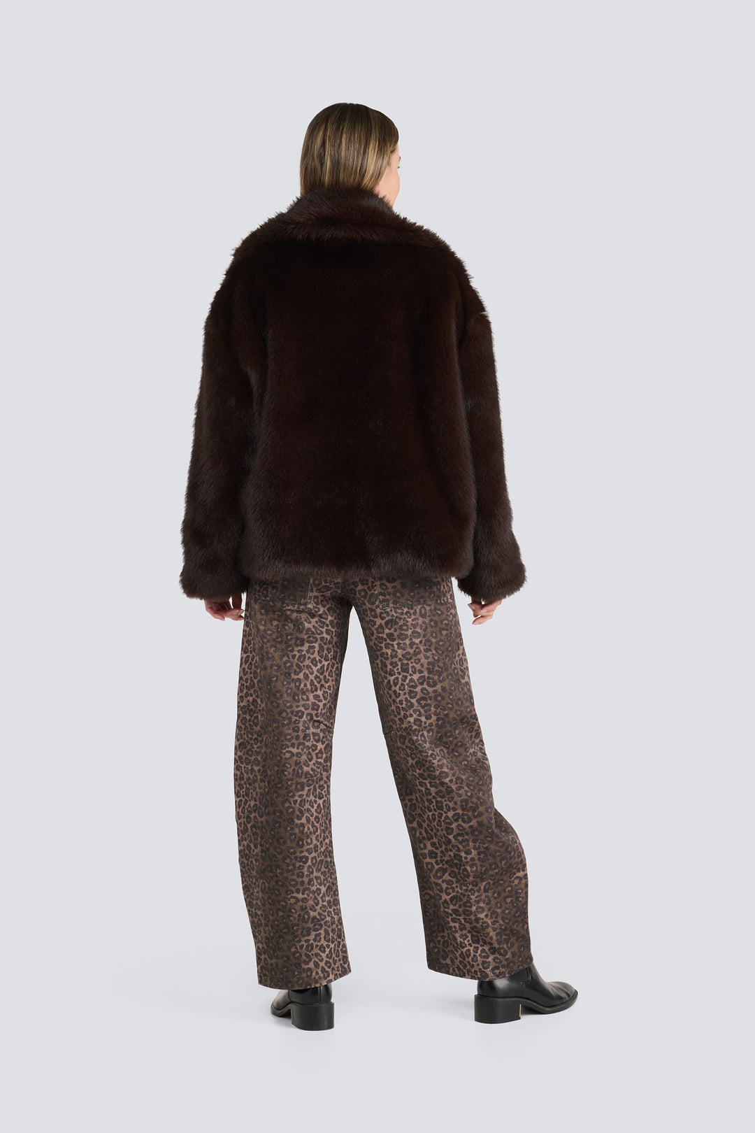 Dark brown plush faux fur jacket paired with leopard print pants.