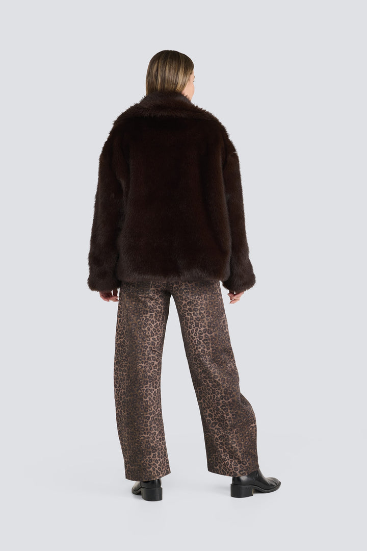 Dark brown plush faux fur jacket paired with leopard print pants.