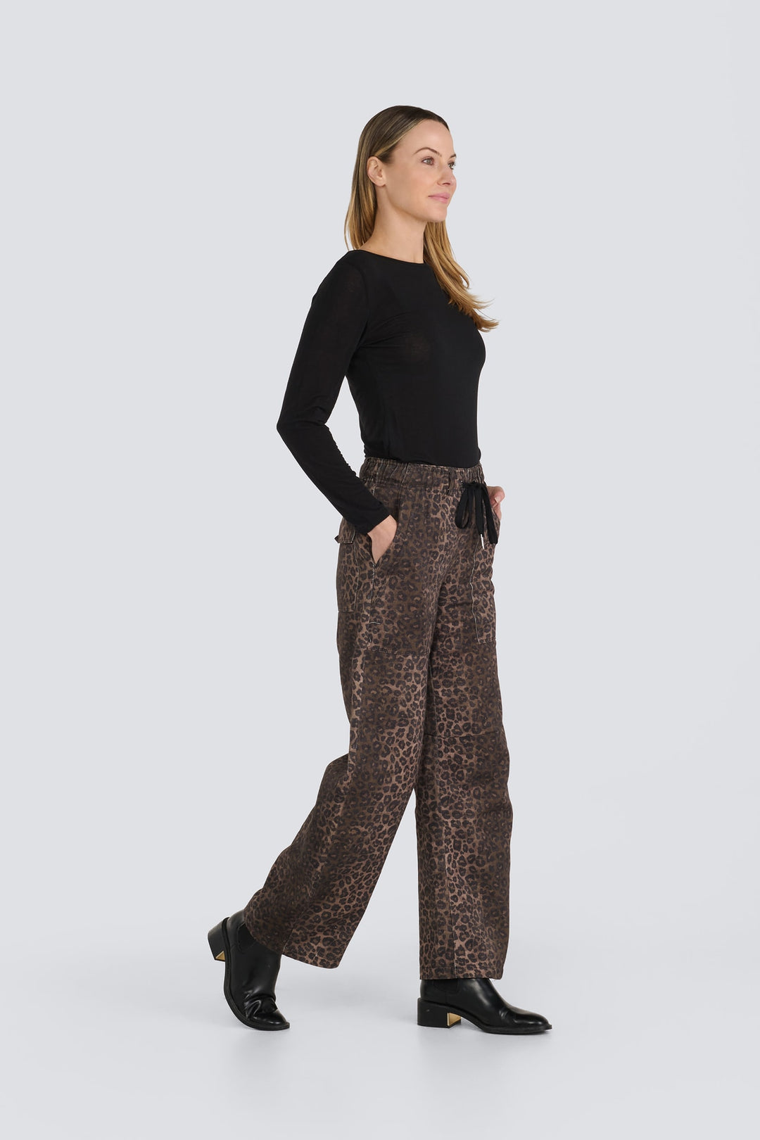 Brown leopard print wide-leg pants featuring a black drawstring waist.
