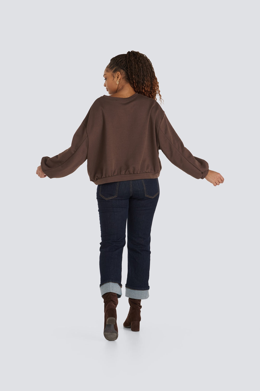 Dark brown long-sleeve crewneck sweatshirt with ribbed hem and balloon sleeves.
