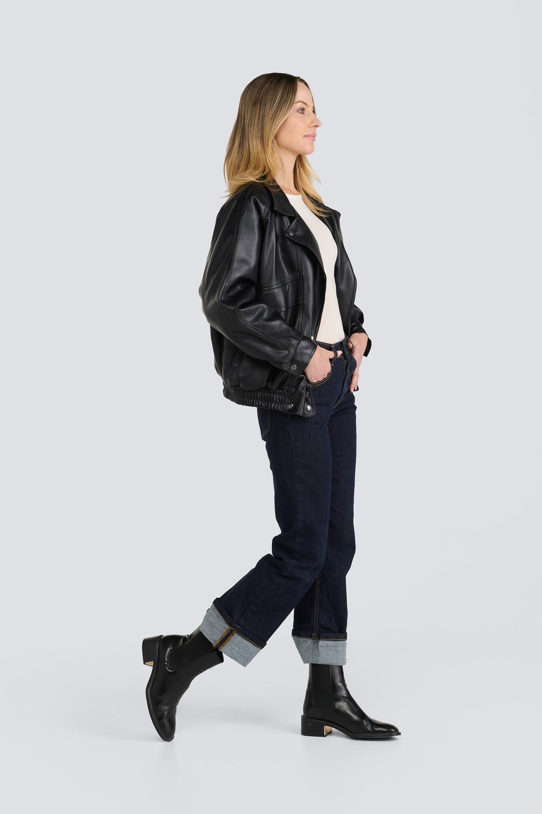 Oversized black leather jacket featuring a lapel collar and an elasticized hem.