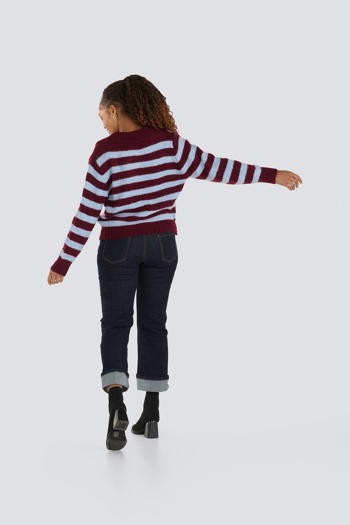 Burgundy and light blue horizontal striped knit sweater with long sleeves.