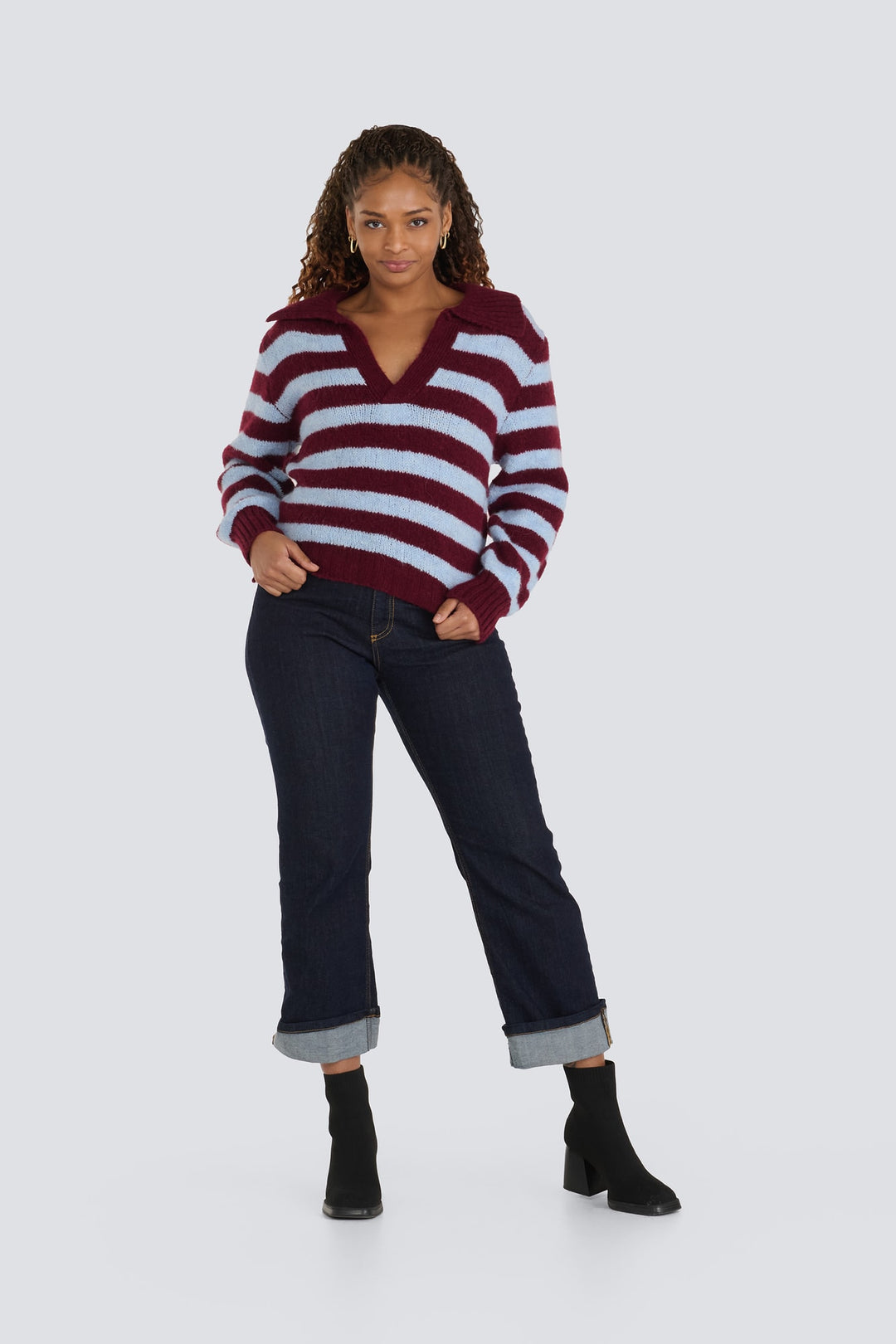 Burgundy and light blue striped knit sweater with a collared open v-neckline.