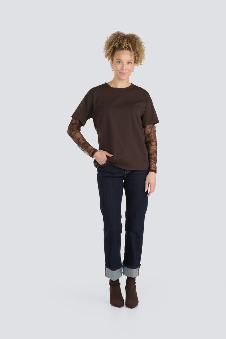 Dark brown crewneck top featuring sheer brown floral lace long sleeves.
